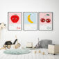 set of 3 alphabet prints A, b, c, on the wall of a nursery featuring an Apple, Banana and Cherries