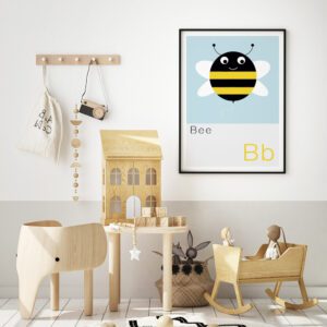 Alphabet print of a bee framed on the wall of a trendy scandi inspired nursery