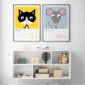 Cat and mouse prints framed on a childs bedroom wall