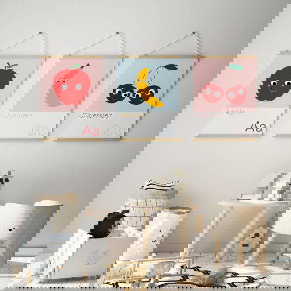 Hanging-frames-Alphabet-prints set of 3 alphabet prints A B C featuring an Apple, Banana and Cherries in wooden hanging frames on the wall of the nursery
