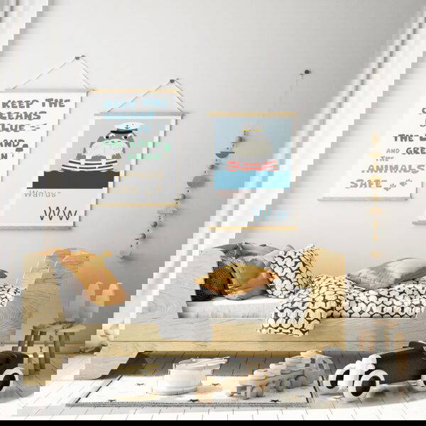 Sealife nursery prints sealife nursery prints hung up in wooden hangers in a trendy scandi nursery