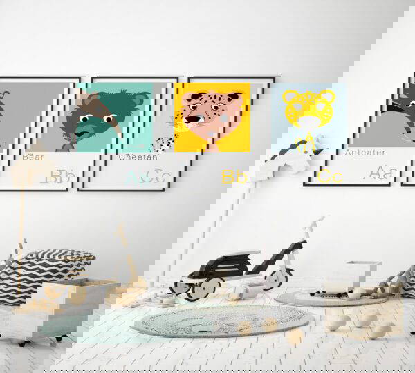 set of three Animal alphabet prints frame in childrens bedroom, scandinavian style set of three animal alphabet prints on wall of a childs room featuring an anteater, bear and cheetah