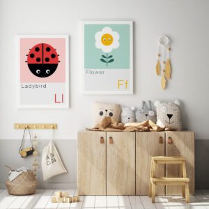 nature prints on a nursery wall featuring a flower and a ladybird
