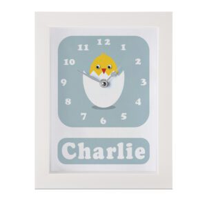 Personalised Children's Clock featuring a chick hatching from an egg with googly eyes