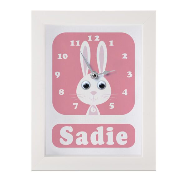 Personalised children's Rabbit Clock featuring a Rabbit with googly eyes on a pink background