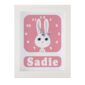 Personalised children's Rabbit Clock featuring a Rabbit with googly eyes on a pink background