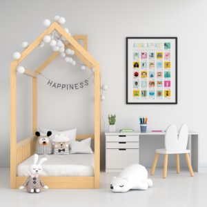 framed Animal Alphabet print on bedroom wall