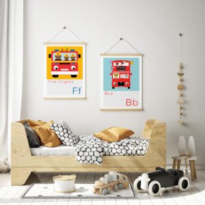 fire engine and london bus prints on the wall of a childs stylish bedroom