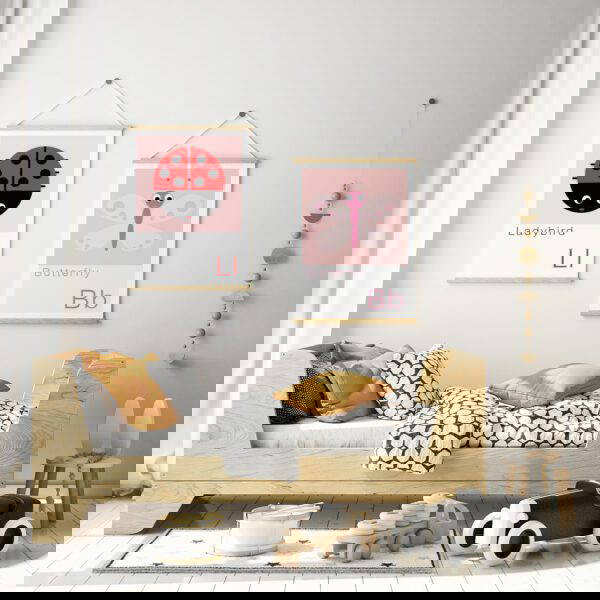 Ladybird and Butterfly poster prints in childs bedroom decor ladybird print and butterfly print in wooden hangers on a childs bedroom wall