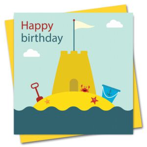 seaside birthday card featuring a sandcastle with bucket and spade