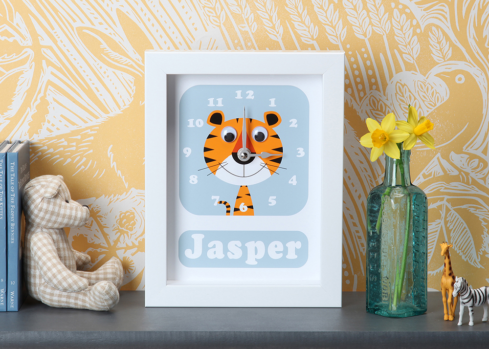 personalised tiger clock on a shelf in kids room