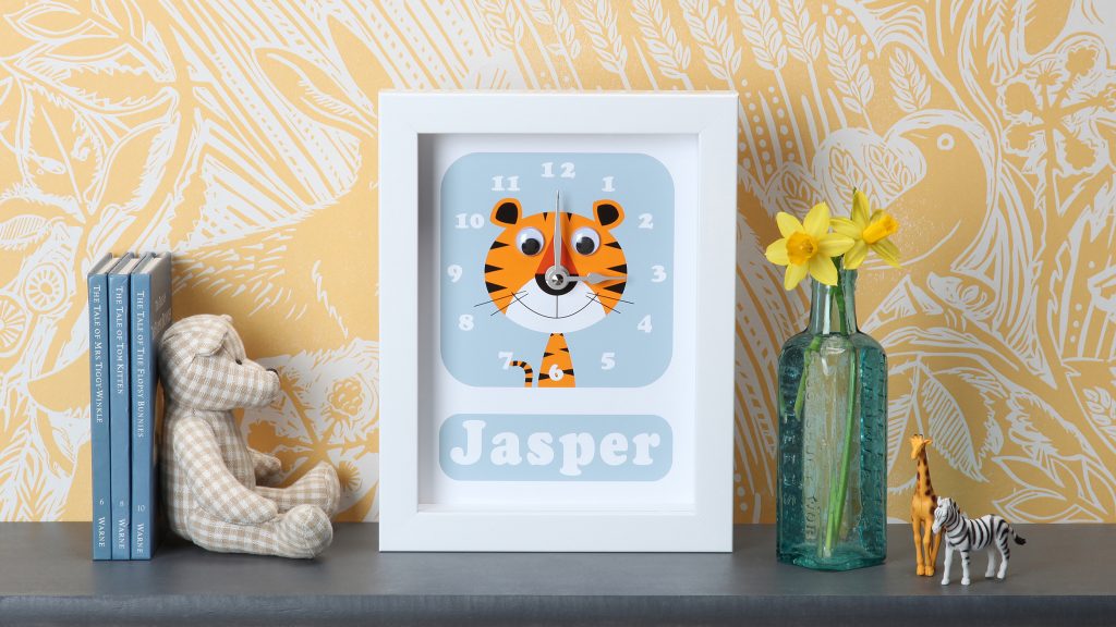 personalised children's clock featuring a tiger with googly eyes by stripey cats